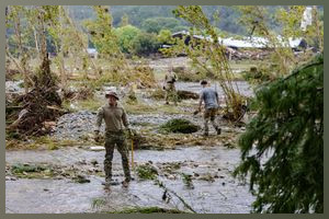 HUNT, TEXAS - JULY 6: Search and rescue workers look through debris for any survivors or remains of people swept up in the flash flooding on July 6, 2025 in Hunt, Texas. Heavy rainfall caused flooding along the Guadalupe River in central Texas with multiple fatalities reported